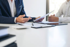 a man discussing with a lawyer