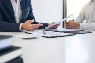 a man discussing with a lawyer