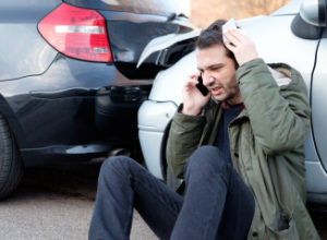 man calling a car accident lawyer for help