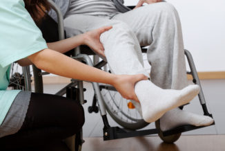 a man on a wheel chair after getting injured in an accident