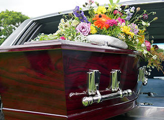 wrongful death casket with flowers