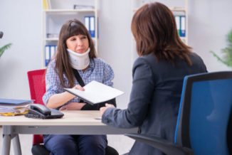 injured workers receiving legal advise from a workers comp attorney
