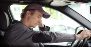 Drowsy Driver in his car