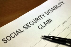 social security disability claim form being filled