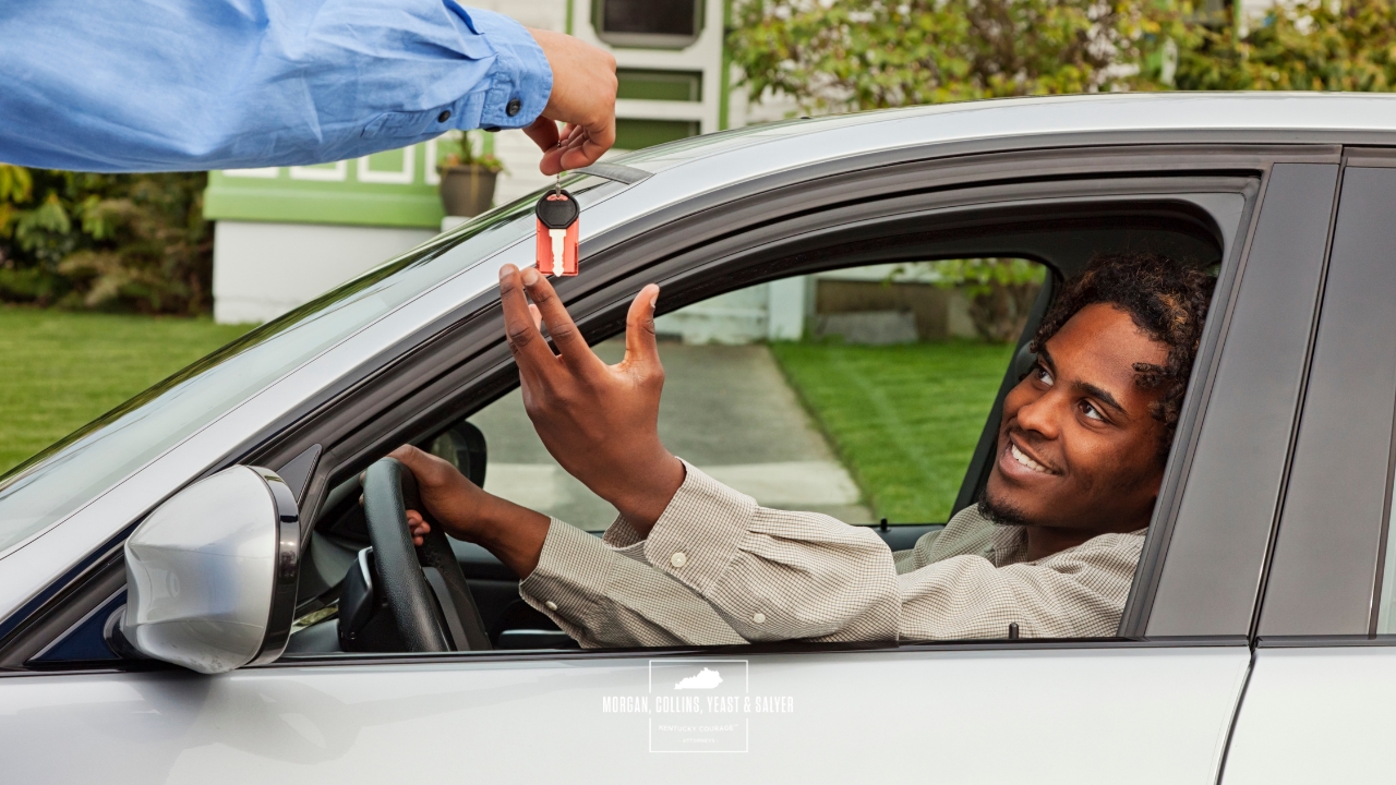 a driver receiving car keys