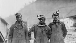 A historical photo of coal mining workers.