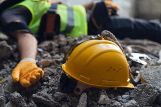 Worker fallen to the floor after having suffered an accident