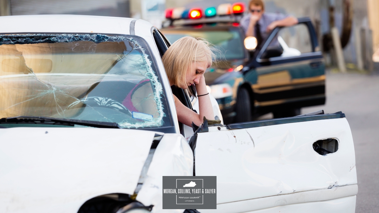 a person sitting in a crashed vehicle