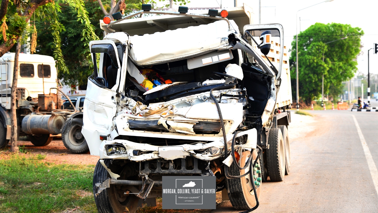 A truck with severe damages to the front after a truck accident
